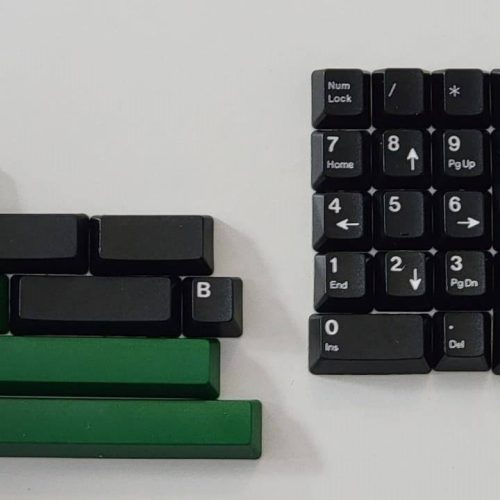 DCS White on Black Extension kit featuring green spacebars and arrow keys, for a different feel